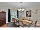 Formal dining room featuring a chandelier, elegant decor, and a large table for gatherings at 508 Whitehead Ct # 328, Fort Mill, SC 29708
