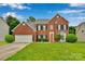 Charming two-story brick home with manicured lawn, attached garage, and inviting front entrance at 508 Whitehead Ct # 328, Fort Mill, SC 29708