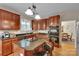 Remodeled kitchen featuring an island cooktop, cherry cabinets, granite countertops, and stainless steel appliances at 508 Whitehead Ct # 328, Fort Mill, SC 29708