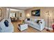 Stylish living room featuring comfortable seating, hardwood floors, and a view into the dining area at 508 Whitehead Ct # 328, Fort Mill, SC 29708