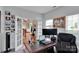 Bright home office featuring double doors, neutral paint, a large desk and natural light at 508 Whitehead Ct # 328, Fort Mill, SC 29708