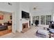 Bright sun room with a fireplace, large windows, and cozy seating, perfect for relaxing or entertaining guests at 508 Whitehead Ct # 328, Fort Mill, SC 29708