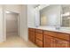 Bathroom featuring a double sink with wood cabinets, toilet and shower at 527 Livingston Dr, Lancaster, SC 29720