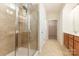Bathroom featuring a shower with tiles and glass door, a sink, and a walk-in closet at 527 Livingston Dr, Lancaster, SC 29720