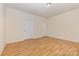 A bedroom with wood floors, neutral walls, and white doors at 527 Livingston Dr, Lancaster, SC 29720