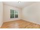 Bedroom with hardwood floors and bright window light at 527 Livingston Dr, Lancaster, SC 29720