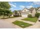 Residential street view showcasing well-maintained homes with green lawns and driveways at 527 Livingston Dr, Lancaster, SC 29720