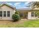 Back of house showing patio area, lots of windows, and a view of the well maintained backyard at 527 Livingston Dr, Lancaster, SC 29720