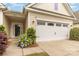 Home exterior featuring a two-car garage, front door, and well-kept landscaping at 527 Livingston Dr, Lancaster, SC 29720