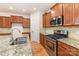 Kitchen featuring granite countertops, stainless steel appliances, and wood cabinets at 527 Livingston Dr, Lancaster, SC 29720
