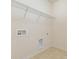 Tile floor laundry room with washer and dryer hookups at 527 Livingston Dr, Lancaster, SC 29720
