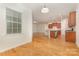 Open-concept living room with hardwood floors and a kitchen island at 527 Livingston Dr, Lancaster, SC 29720
