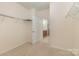 Walk-in closet with carpeted floors and white walls with shelves at 527 Livingston Dr, Lancaster, SC 29720