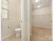 Walk-in closet with a window and toilet at 527 Livingston Dr, Lancaster, SC 29720