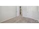 Neutral bedroom featuring plush carpet, ensuite access, and a double door closet at 5324 Somerset Hill Ln, Charlotte, NC 28269