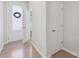 Inviting entryway with a decorative glass door, neutral walls, and light wood floors at 5324 Somerset Hill Ln, Charlotte, NC 28269