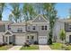 Charming two-story townhome with a well-manicured lawn and attached one car garage at 5324 Somerset Hill Ln, Charlotte, NC 28269