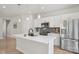 Modern kitchen features white cabinets, stainless steel appliances, an island, and stylish pendant lighting at 5324 Somerset Hill Ln, Charlotte, NC 28269