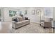 Comfortable living room featuring a cozy seating area and a decorative rug at 5324 Somerset Hill Ln, Charlotte, NC 28269