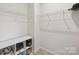 A well-organized walk-in closet with shelving, creating ample storage space at 5324 Somerset Hill Ln, Charlotte, NC 28269
