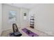 Bright workout room featuring free weights, exercise bench and window with shades at 5324 Somerset Hill Ln, Charlotte, NC 28269