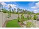 This backyard features new sod, landscaping and a privacy fence at 5332 Orchid Bloom Dr, Indian Land, SC 29707