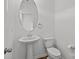 This bathroom features a white pedestal sink and toilet, with modern fixtures and classic design at 5332 Orchid Bloom Dr, Indian Land, SC 29707