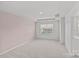 A bright bedroom with carpet flooring and a large window bringing in natural light at 5332 Orchid Bloom Dr, Indian Land, SC 29707