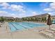 Community pool with lounge chairs for relaxing and enjoying the sunshine at 5332 Orchid Bloom Dr, Indian Land, SC 29707