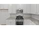 The kitchen has granite countertops, stainless steel appliances, and white subway tile backsplash at 5332 Orchid Bloom Dr, Indian Land, SC 29707
