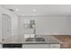 A kitchen island with granite countertops, a stainless steel dishwasher and sink at 5332 Orchid Bloom Dr, Indian Land, SC 29707
