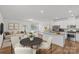 Open concept living space with an island kitchen, dining area, and comfortable seating at 5332 Orchid Bloom Dr, Indian Land, SC 29707