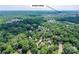 Aerial neighborhood view highlights proximity to Birkdale Village and lush greenery at 541 Greenway St, Davidson, NC 28036