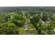 Real estate showing a well-maintained home with green lawn, mature trees in a peaceful neighborhood at 5918 Barrington Dr, Charlotte, NC 28215