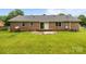 Spacious backyard with a brick exterior and concrete patio for outdoor enjoyment at 5918 Barrington Dr, Charlotte, NC 28215