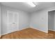 Light and airy bedroom with hardwood floors and closet with bifold doors at 5918 Barrington Dr, Charlotte, NC 28215