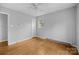 Spacious bedroom with hardwood floors, ceiling fan, and natural light at 5918 Barrington Dr, Charlotte, NC 28215