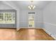 Bright dining room with hardwood floors and classic chandelier at 5918 Barrington Dr, Charlotte, NC 28215