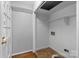 Functional laundry area with built-in shelves and tile floors at 5918 Barrington Dr, Charlotte, NC 28215