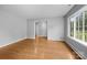 Cozy living room featuring hardwood floors and a large window at 5918 Barrington Dr, Charlotte, NC 28215