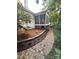 Exterior view of screened porch, landscaping, and stone walkway enhances the property's appeal at 5929 Waterelm Ln, Charlotte, NC 28269