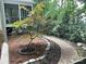Exterior of house with a stone walkway, landscaping, and covered porch at 5929 Waterelm Ln, Charlotte, NC 28269