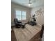 Bedroom featuring an exercise stepper, neutral paint, chair, and a large window with plantation shutters at 5929 Waterelm Ln, Charlotte, NC 28269