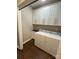 Laundry room with white cabinets, laundry sink, and white washer and dryer at 5929 Waterelm Ln, Charlotte, NC 28269