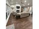 Spacious living room with a fireplace, hardwood flooring, neutral paint and large windows at 5929 Waterelm Ln, Charlotte, NC 28269