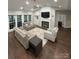 Bright and airy living room showcasing hardwood floors, fireplace, and ample seating at 5929 Waterelm Ln, Charlotte, NC 28269