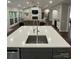 Large living area showing open concept kitchen with island, fireplace, and wet bar at 5929 Waterelm Ln, Charlotte, NC 28269