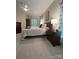 Main bedroom features neutral walls, carpet flooring, a king bed, and a nightstand with a lamp at 5929 Waterelm Ln, Charlotte, NC 28269