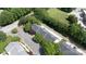 Aerial view of townhomes with mature trees and a lush green lawn at 609 Atherton Way, Rock Hill, SC 29730
