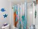 Bathroom featuring a shower with a unique colorful curtain and decorative fish on the walls at 609 Atherton Way, Rock Hill, SC 29730